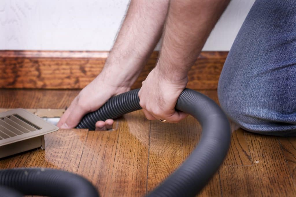 Heating Vent Air Duct Getting Cleaned